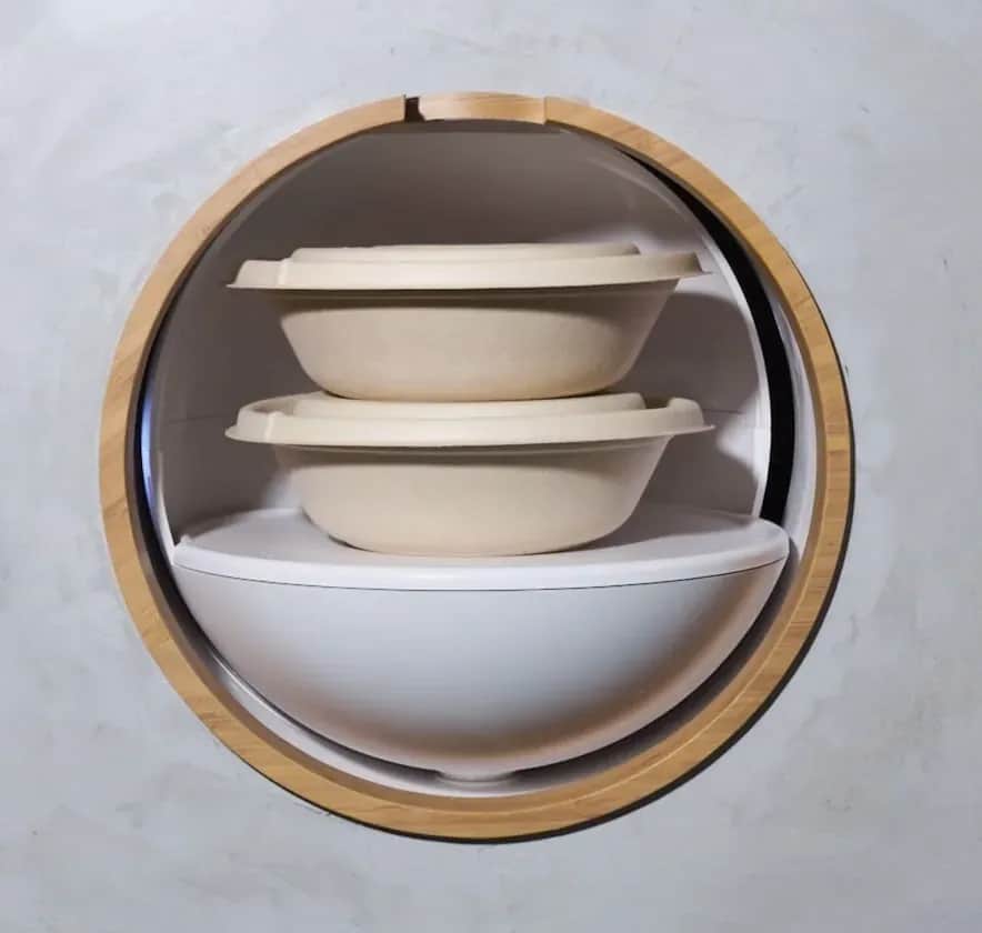 Bamboo Bowls pod fully open, showing two covered meal bowls on its shelf ready for pickup.
